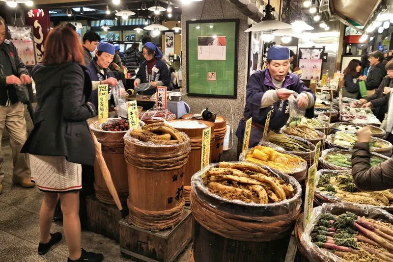 market vendor at Nishiki food market in Kyoto