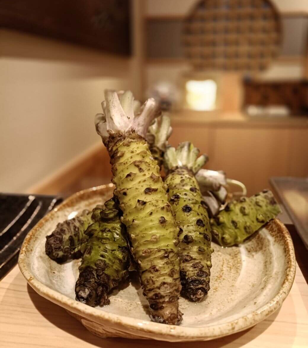 learning about wasabi at sushi making class in Tokyo
